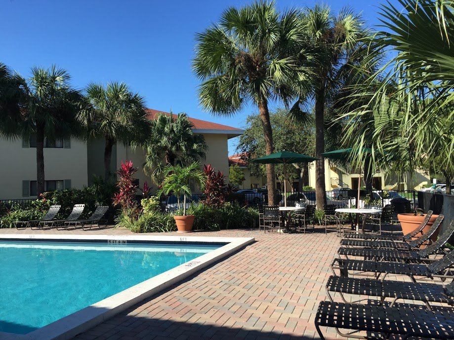 Swimming pool and tropical landscaping at Marina Oaks Condominium